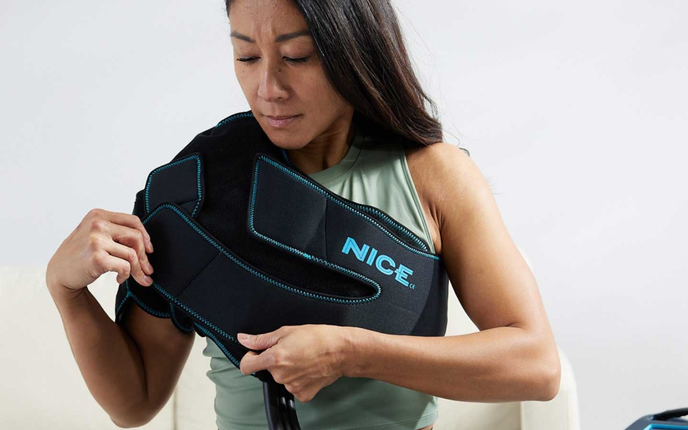 Nice 1 cold and compression sleeve on a oriental woman's shoulder