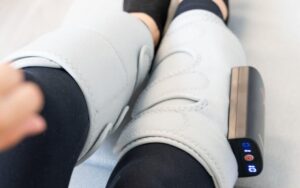 A pair of legs wearing a DVT device