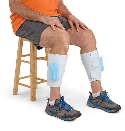 Man sitting on a stool wearing Venapro DVT compression