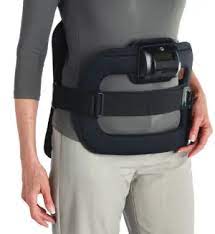 a woman with a bone stimulation device around her waist